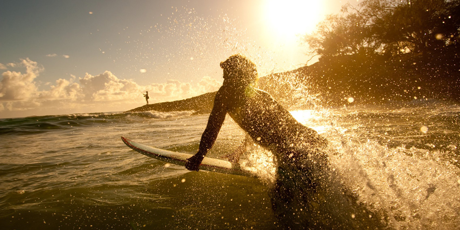 image of AARONTAIT COPYRIGHTED 2014 137  ADVERTISING LIFESTYLE BEACH ISLAND LIFE SURFER WATER HITTING THE BREAK SUNRISE SPLASHING
