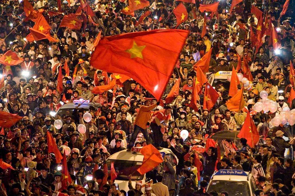 image of AARONTAIT COPYRIGHTED 2014 484 VIETNAM GLORY VICTORY FOOTBALL CELEBRATION HANOI FANS PATRIOTISM HAPPY RIOT FLARE DOCUMENTARY REPORTAGE PHOTOGRAPHER 