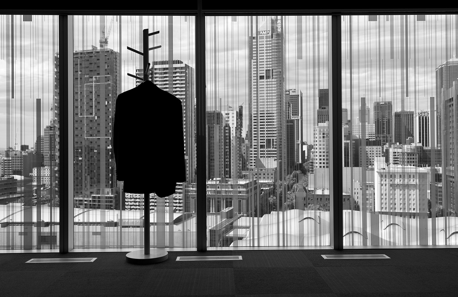 image of AARONTAIT COPYRIGHTED 2014 160 CORPORATE BUSINESS EXECUTIVES POWER COMMERCE DOCUMENTARY REPORTAGE OFFICE SILHOUETTE METAPHOR SUIT COAT VIEW PANORAMA  