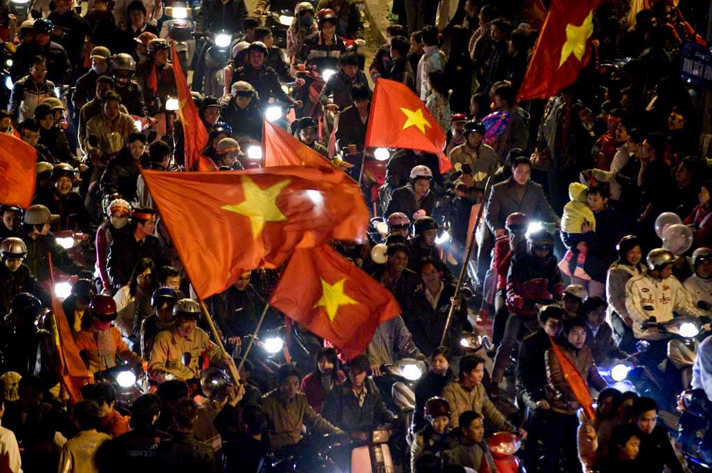 image of AARONTAIT COPYRIGHTED 2014 483 VIETNAM GLORY VICTORY FOOTBALL CELEBRATION HANOI FANS PATRIOTISM HAPPY RIOT FLARE DOCUMENTARY REPORTAGE PHOTOGRAPHER 